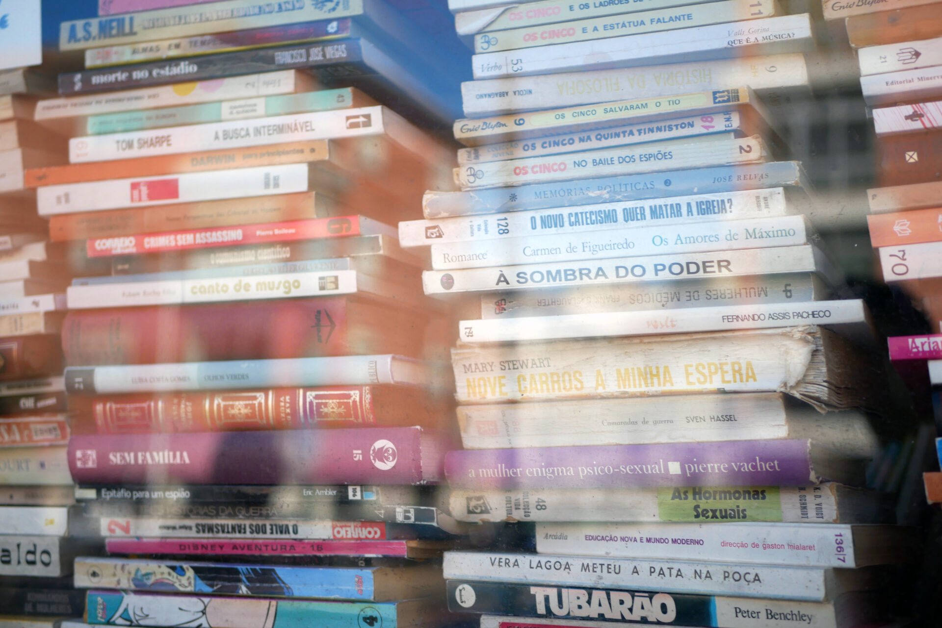 Full frame shot of books seen through window