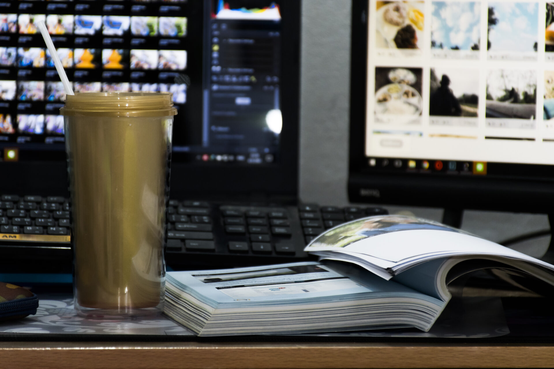 A golden mug sits on the table and a book is placed beside it. And with the background, it's a noteb